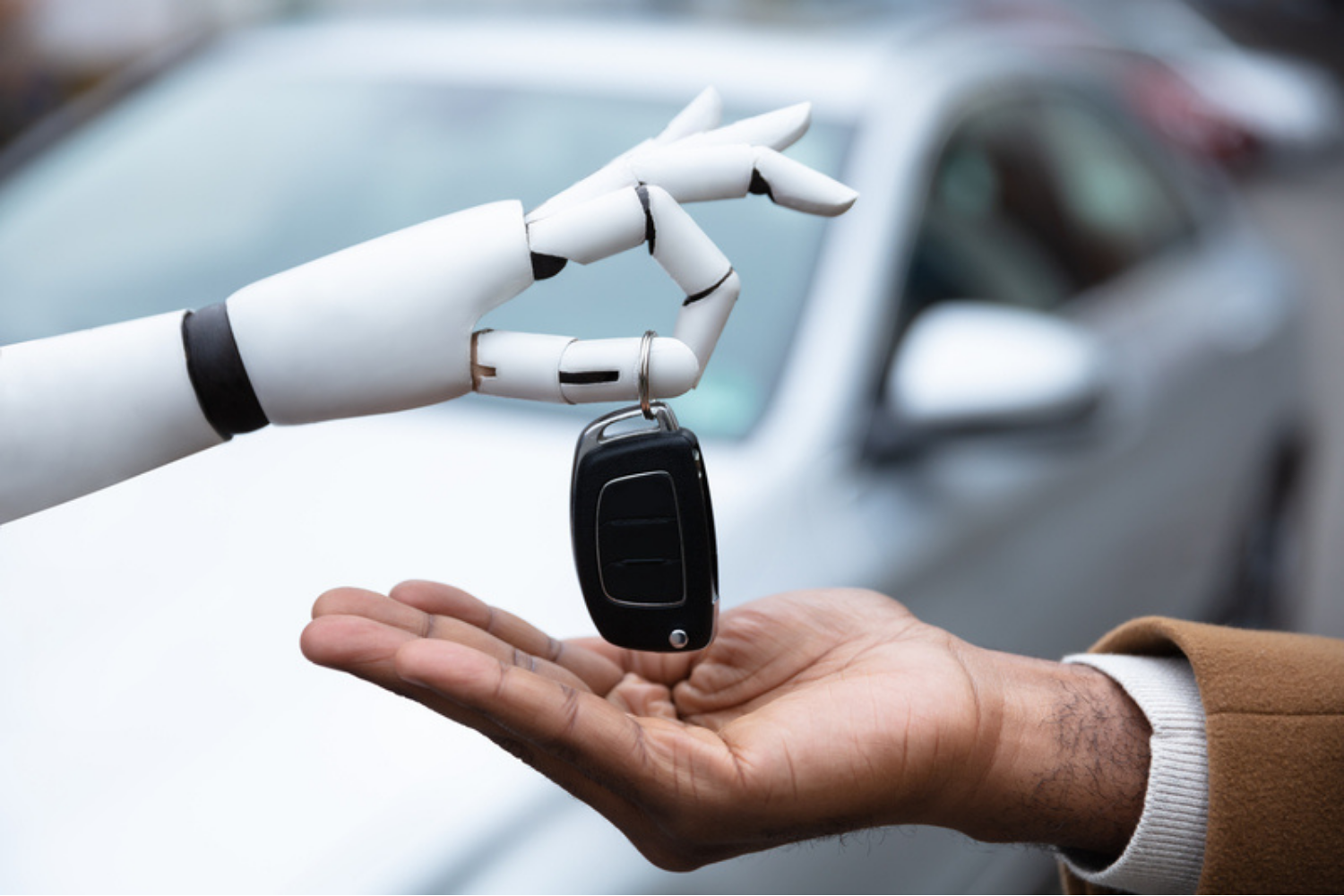robot handing car keys to a person
