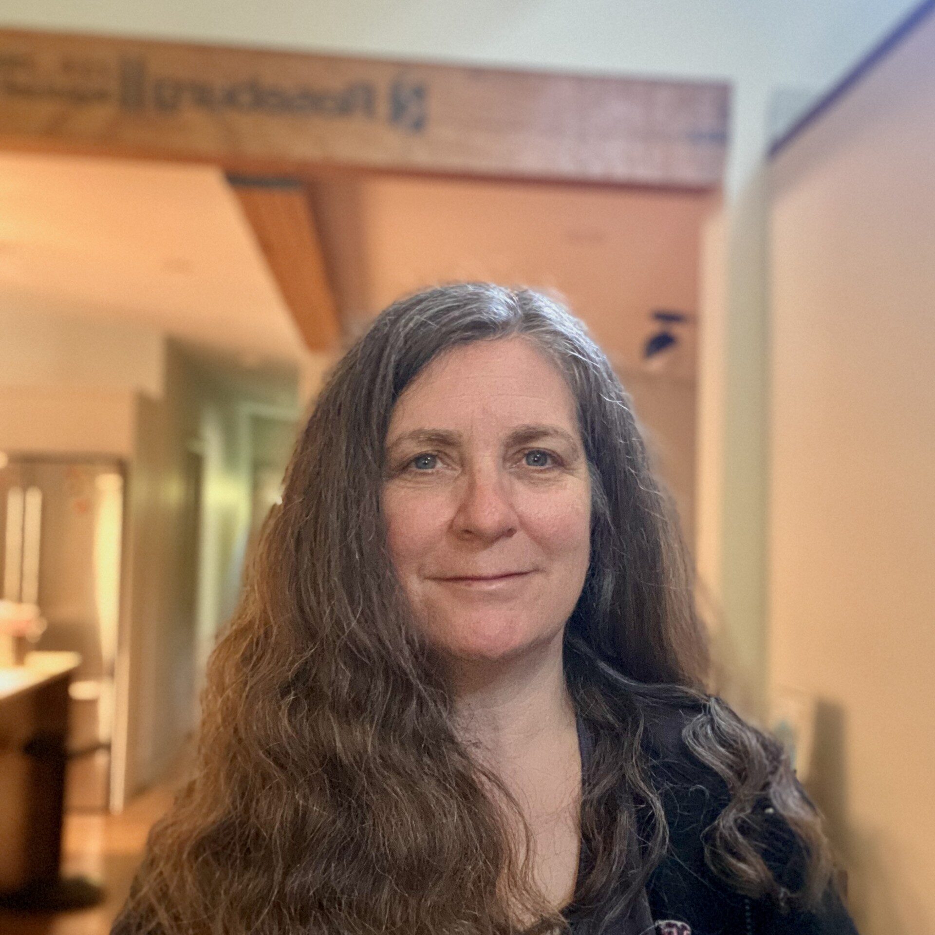 Woman with long brown hair. 
